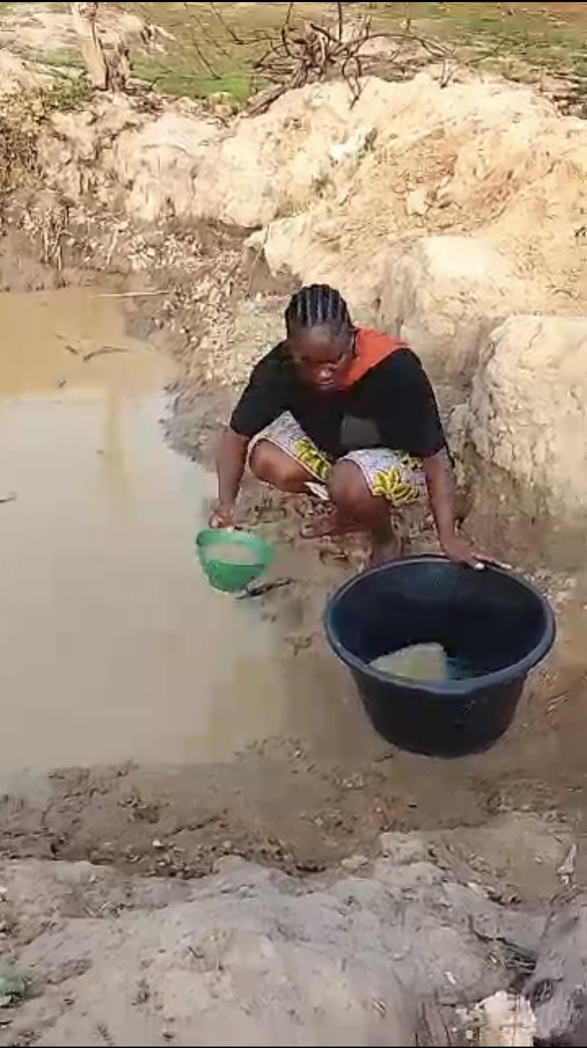 Community member collecting water